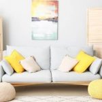 yellow and baby blue sofa art on wall