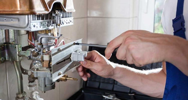 combi boiler installation cost guide — combi boiler being installed by a heating engineer