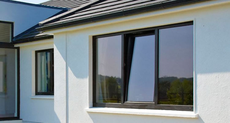 an open triple glazed window installation in the UK